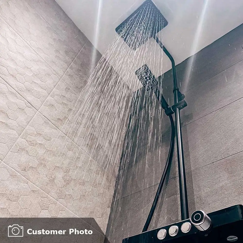 Buxy Gris in a shower area being used as a feature strip with matching wall tiles and shower on for effect