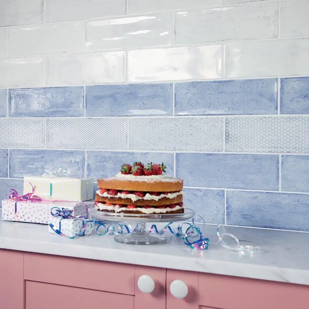 Arles Snow décor mix gloss tile with Sea (blue) and Snow brick bonded on kitchen wall