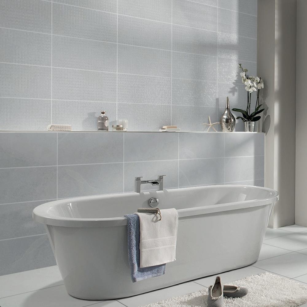 Cliveden grey ceramic wall tile being used as a feature behind a freestanding bath
