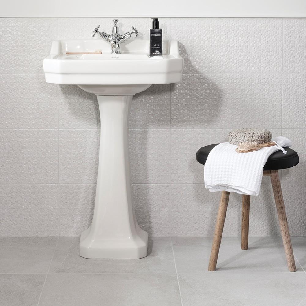 Traditional bathroom featuring white floor tiles and coordinating white hexagon decors from the Cliveden tile collection
