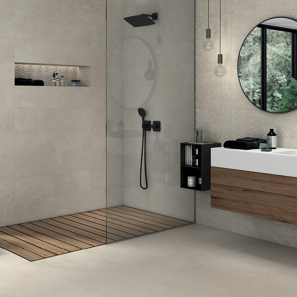 Modern walk in shower room showing Cliveden cream floor tiles with coordinating wall and décor tiles