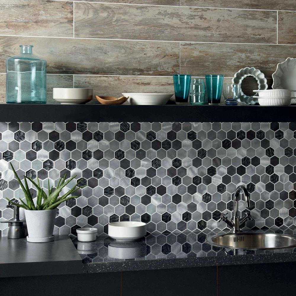 Colby Black Mix Glass & Metal Hexagon Mosaic used as splashback in a modern kitchen with contrasting wood panelling