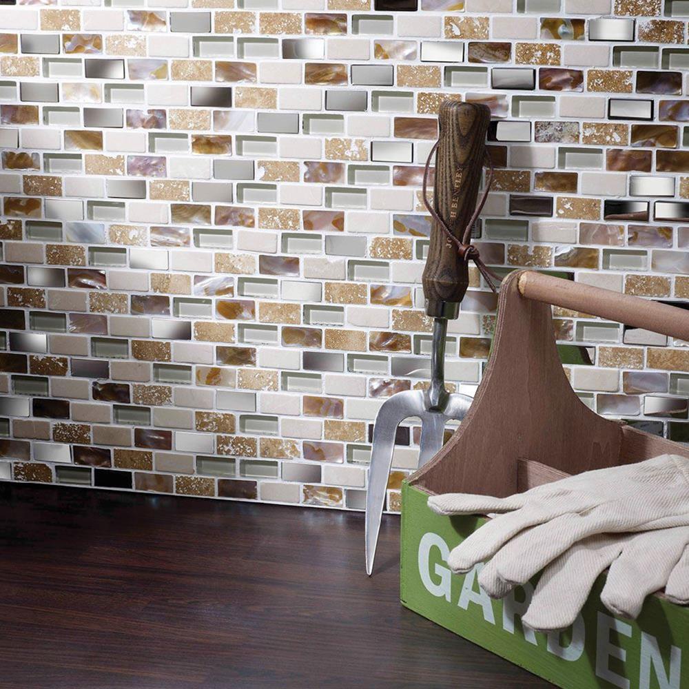 Close up of Cream Glass/Stone/Metal/Pearl Mix Mini Brick Mosaic on kitchen utility wall with garden accessories