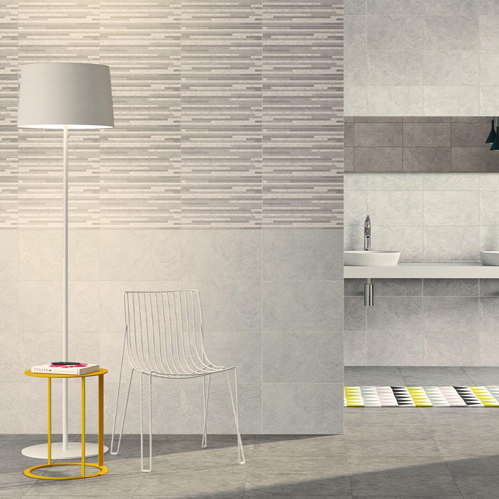 400x250 Dovedale light grey relief décor with complimenting wall tiles and floor tiles in a open plan bathroom