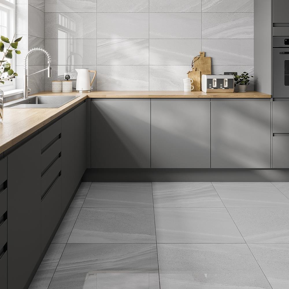 Modern dark gloss grey kitchen with the pescara 600x600 on the floor and the pescara 600x300 on the wall