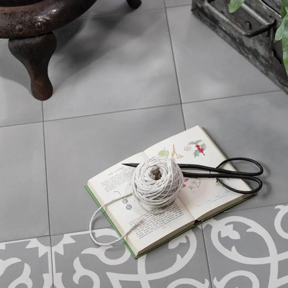 Contrasti Girgio plain tile on the floor, with complimenting feature with book and scissors