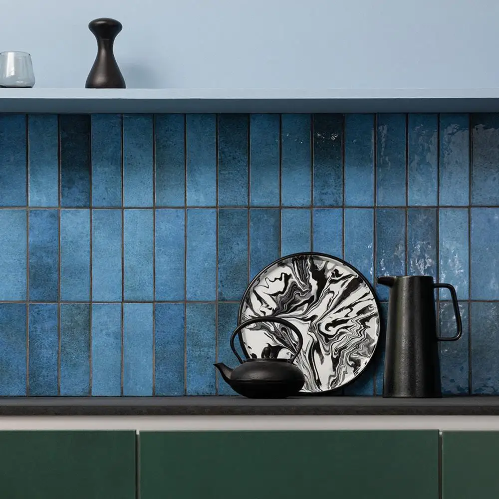 Dyroy blue being used as a kitchen splashback with oak counter tops