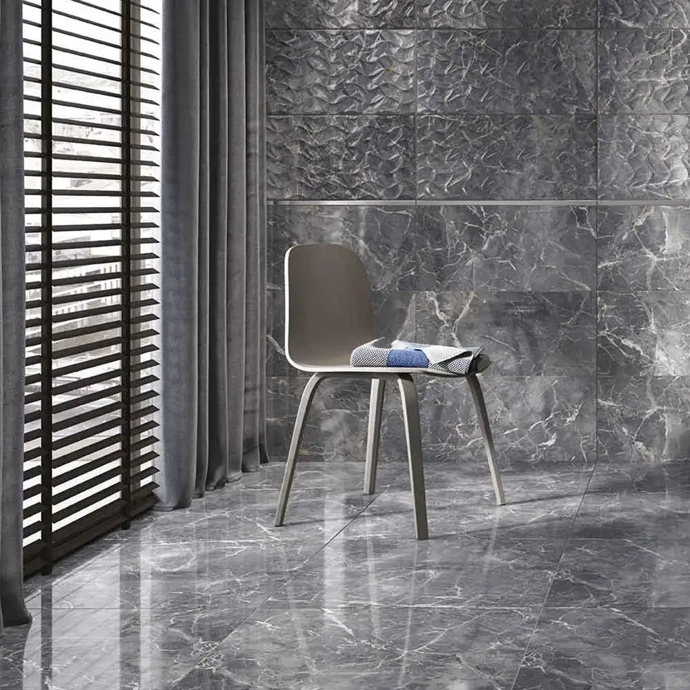 Close up of Nebula Grey Gloss marble effect tile on bathroom wall with chair and accessories