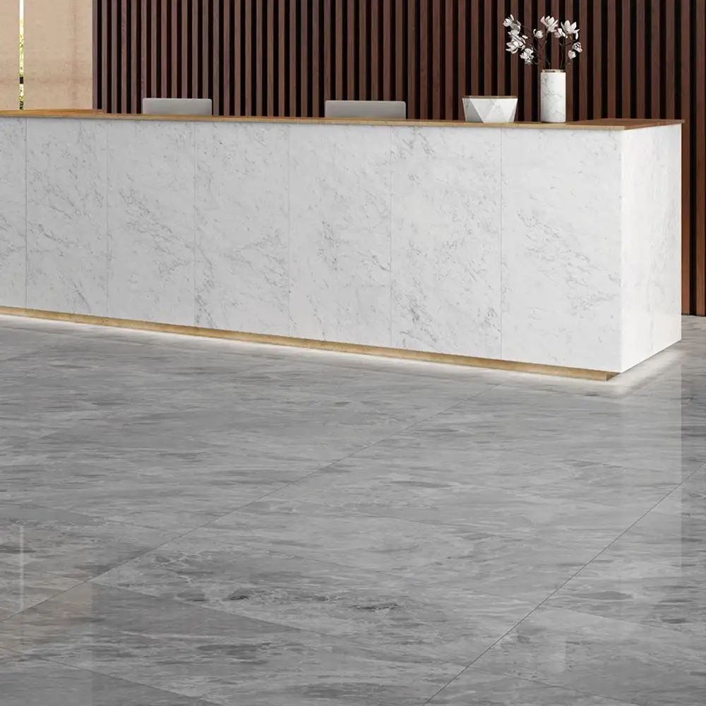 Marmori cloud grey tile in a reception lobby with Marmori calacatta welcome desk