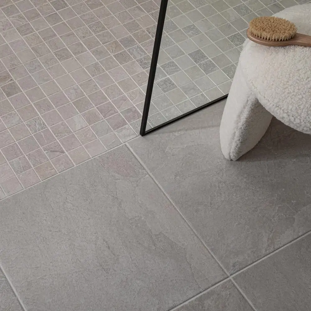 wall mounted sink with the nature bone conept tile behind and the rest of the walls with the nature bone plain tile